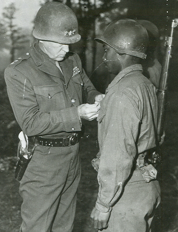 Patton presents the Silver Star to African American GI
