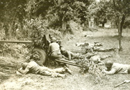 Anti-tank GIs lay low amid German shelling in Avranches, France