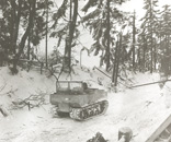 GI driving a Weasel toward Schopen, Belgium