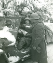 Back from the Ardennes, William Rush shares a Christmas present with his buddies