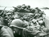 GIs cross the Rhine in an assault boat near St. Goar, Germany