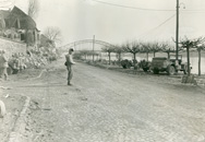 A Ninth Army MP stands guard along the Rhine at Erpel, Germany