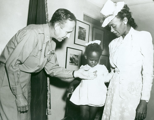 Melba Rose and Rosie L. Madison accept the Silver Star awarded posthumously to 1st Lieutenant John W. Madison