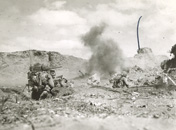 Marines mortaring Japanese dugout