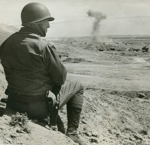 Patton watching tanks battle in Tunisia