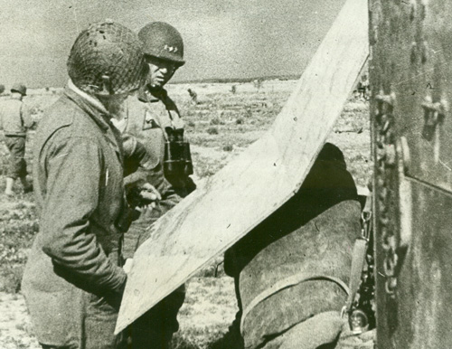 Patton examining a map in Tunisia