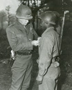 Patton pins the Silver Star on Ernest Jenkins