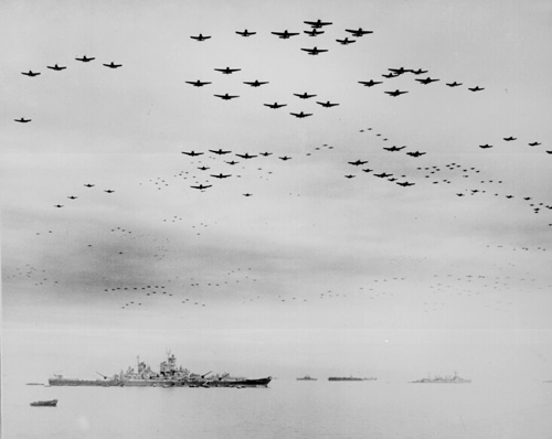 Corsairs and Hellcats fly over the USS Missouri