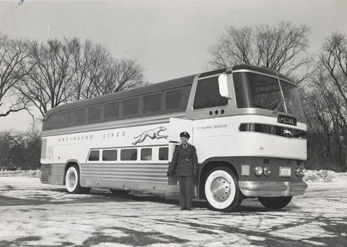Greyhound bus with driver outside