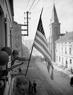 The Stars and Stripes appears over Bitche, France, March 16, 1945