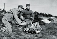 Men of the 21st Signal Loft release pigeons in March 1943 (National Archives)